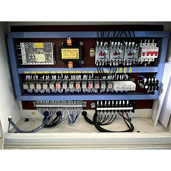 315-ton-hydraulic-press-electrical-control-panel-interior Interior view of the electrical control panel for the 315 ton four column hydraulic press, showing PLC, contactors, and safety wiring.